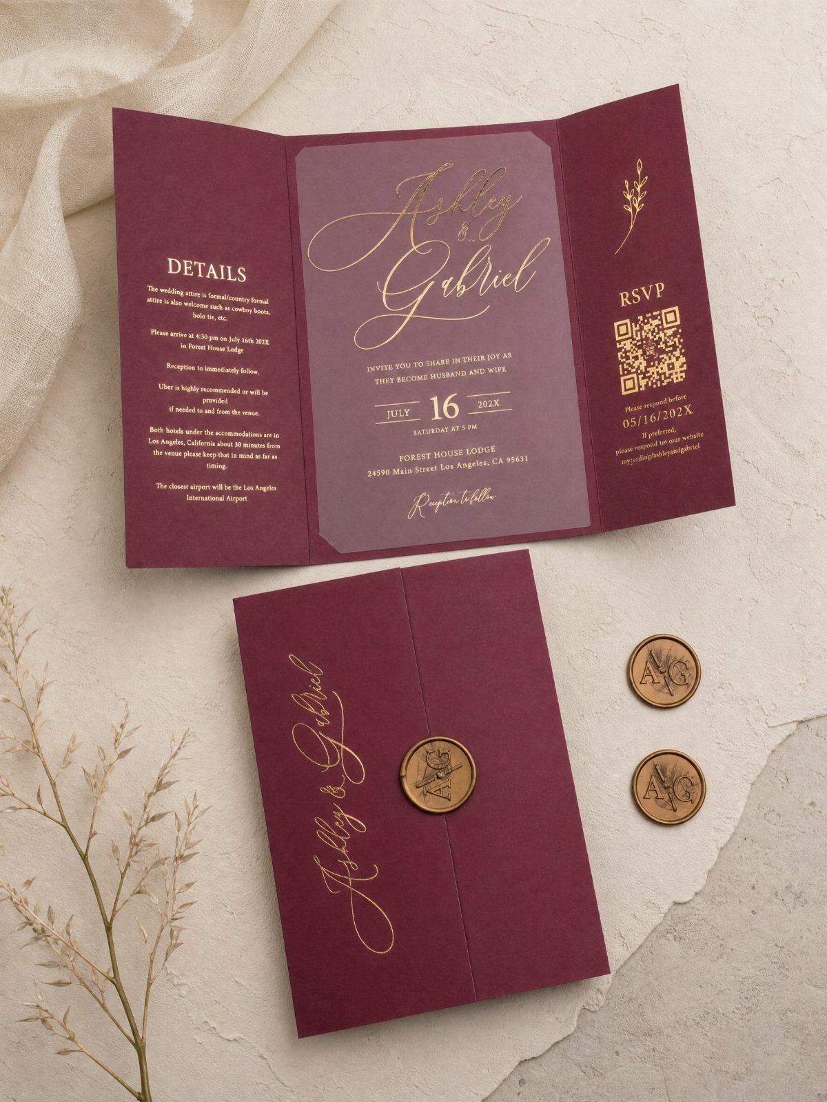 Burgundy wedding invitation suite with gold foil lettering and gold wax seals.