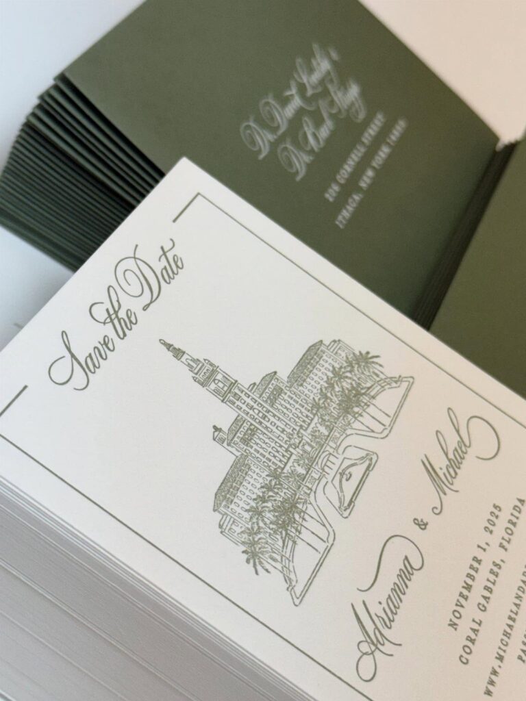 White save the date cards with green architectural line art and script typography.