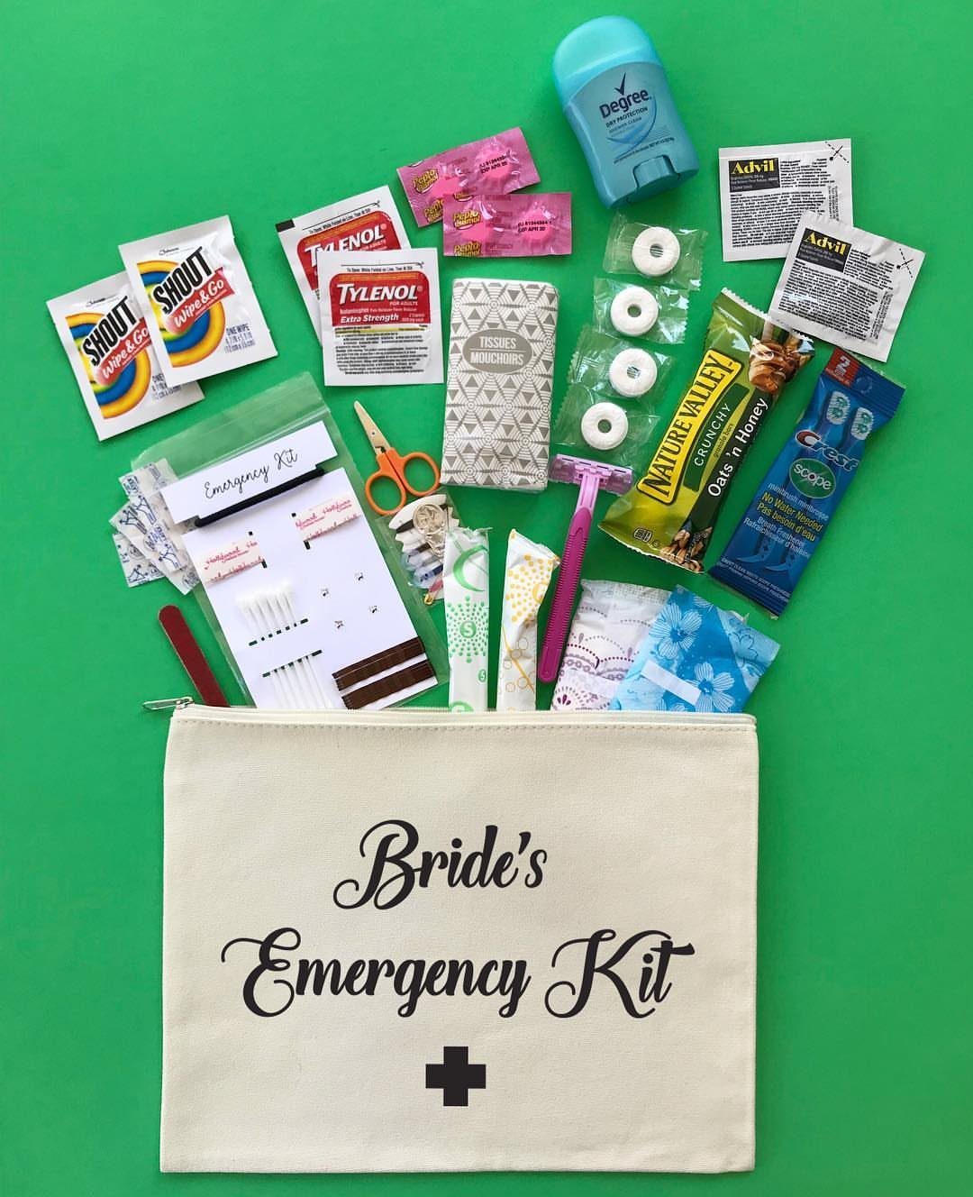 Bride's Emergency Kit pouch surrounded by medicine, snacks, and grooming tools on green background
